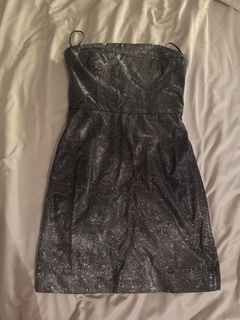 MESHKI Silver Glitter Strapless Mini Dress Size S (Category: Dresses) located in Cebu City. Submitted by _t.rix (Listing ID 1470562077, Image 1). Description: - Brand/Model: Meshki silver glitter strapless mini dress - Size: Small (S) - Features: Structured bodice with inner lining, exposed metal back zipper, and thin spaghetti straps - Finish: Textured metallic that catches the light - Condition: Worn once for a few hours, zero flaws, practicall