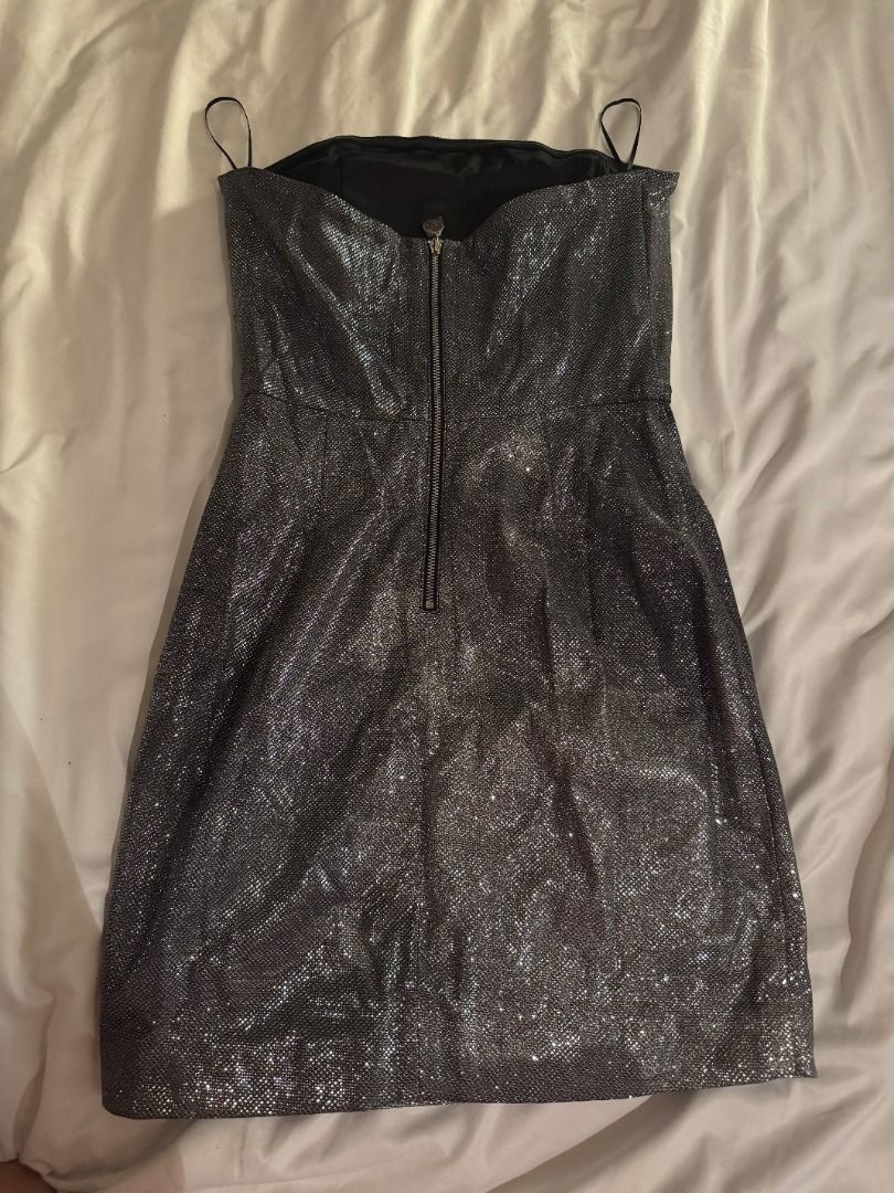 MESHKI Silver Glitter Strapless Mini Dress Size S (Category: Dresses) located in Cebu City. Submitted by _t.rix (Listing ID 1470562077, Image 3). Description: - Brand/Model: Meshki silver glitter strapless mini dress - Size: Small (S) - Features: Structured bodice with inner lining, exposed metal back zipper, and thin spaghetti straps - Finish: Textured metallic that catches the light - Condition: Worn once for a few hours, zero flaws, practicall