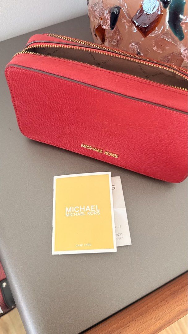 Michael Kors – Double Zip Pouch (Category: Purses & Pouches) located in Santa Rosa. Submitted by stealbydiva (Listing ID 1470626129, Image 3). Description: Original Michael Kors Red Double Zip Wristlet/Pouch ❤️ • Style code: 35S0GTVU3L • Leather material • Made in Vietnam • Comes with the original gift receipt Condition - Used once. Has a makeup stain and minor scratches around the zipper area. Please check all photos carefully for the actual con