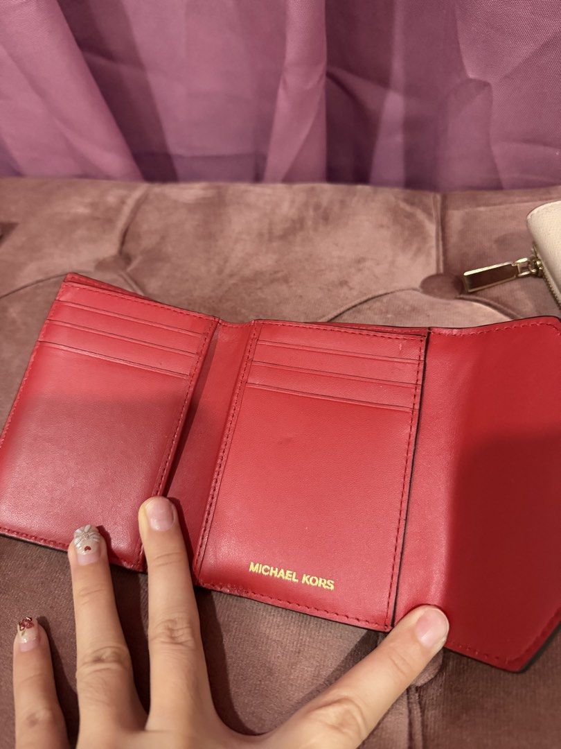 Michael Kors Red Tri-fold Leather Wallet (Category: Wallets & Card holders) located in Paranaque City. Submitted by kaonakeimi (Listing ID 1470697418, Image 3). Description: MK RED SMALL ENVELOPE WALLET - may super small white stain lang - no bakbak or tuklap - 800 MK CREAM ENVELOPE SAFFIANO LEATHER - no bakbak also -1000 ALL ORIGINAL. BOUGHT FROM MK STORE IN STATES.