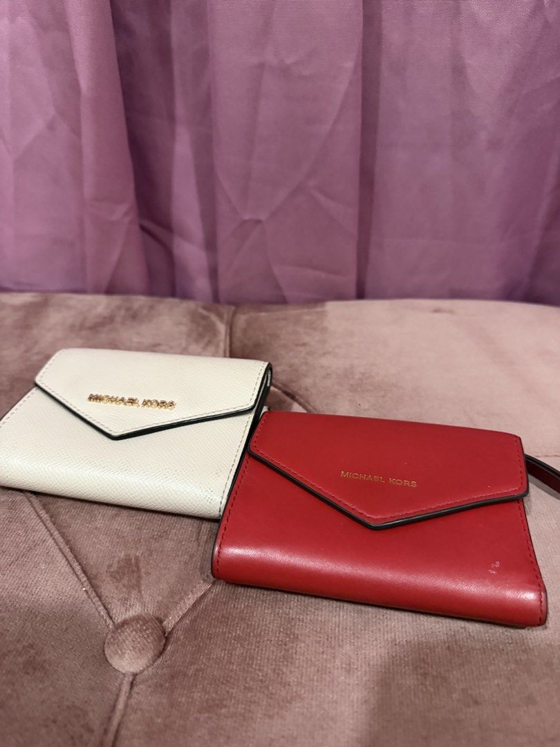 Michael Kors Red Tri-fold Leather Wallet (Category: Wallets & Card holders) located in Paranaque City. Submitted by kaonakeimi (Listing ID 1470697418, Image 1). Description: MK RED SMALL ENVELOPE WALLET - may super small white stain lang - no bakbak or tuklap - 800 MK CREAM ENVELOPE SAFFIANO LEATHER - no bakbak also -1000 ALL ORIGINAL. BOUGHT FROM MK STORE IN STATES.