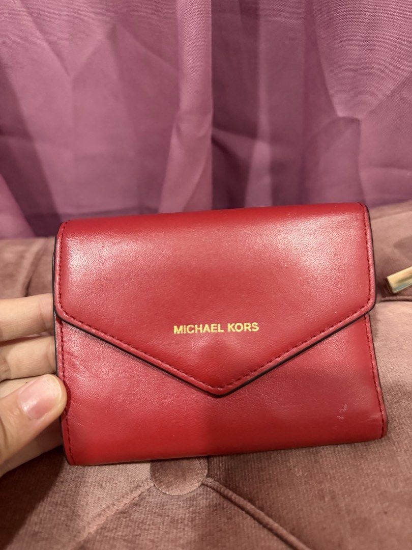 Michael Kors Red Tri-fold Leather Wallet (Category: Wallets & Card holders) located in Paranaque City. Submitted by kaonakeimi (Listing ID 1470697418, Image 2). Description: MK RED SMALL ENVELOPE WALLET - may super small white stain lang - no bakbak or tuklap - 800 MK CREAM ENVELOPE SAFFIANO LEATHER - no bakbak also -1000 ALL ORIGINAL. BOUGHT FROM MK STORE IN STATES.