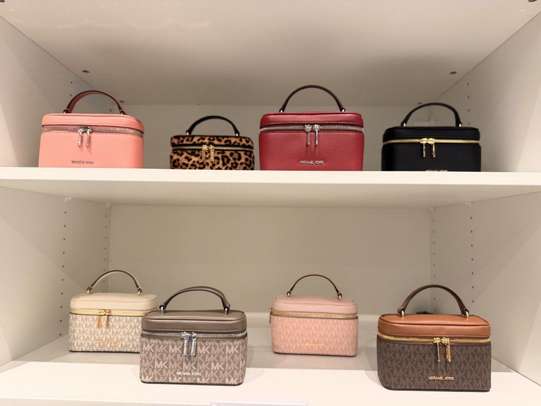 Michael Kors Vanity Case Collection Multiple Colors Available (Category: Luxury Bags & Wallets) located in Manila. Submitted by thriftsbyfelas (Listing ID 1470674089, Image 1). Description: - Authentic Michael Kors vanity bags - Available in solid colors, leopard print, and classic monograms - Compact and structured boxy design - Features a convenient top handle and double zipper closure - Premium metal hardware accents - Price is per piece, mess