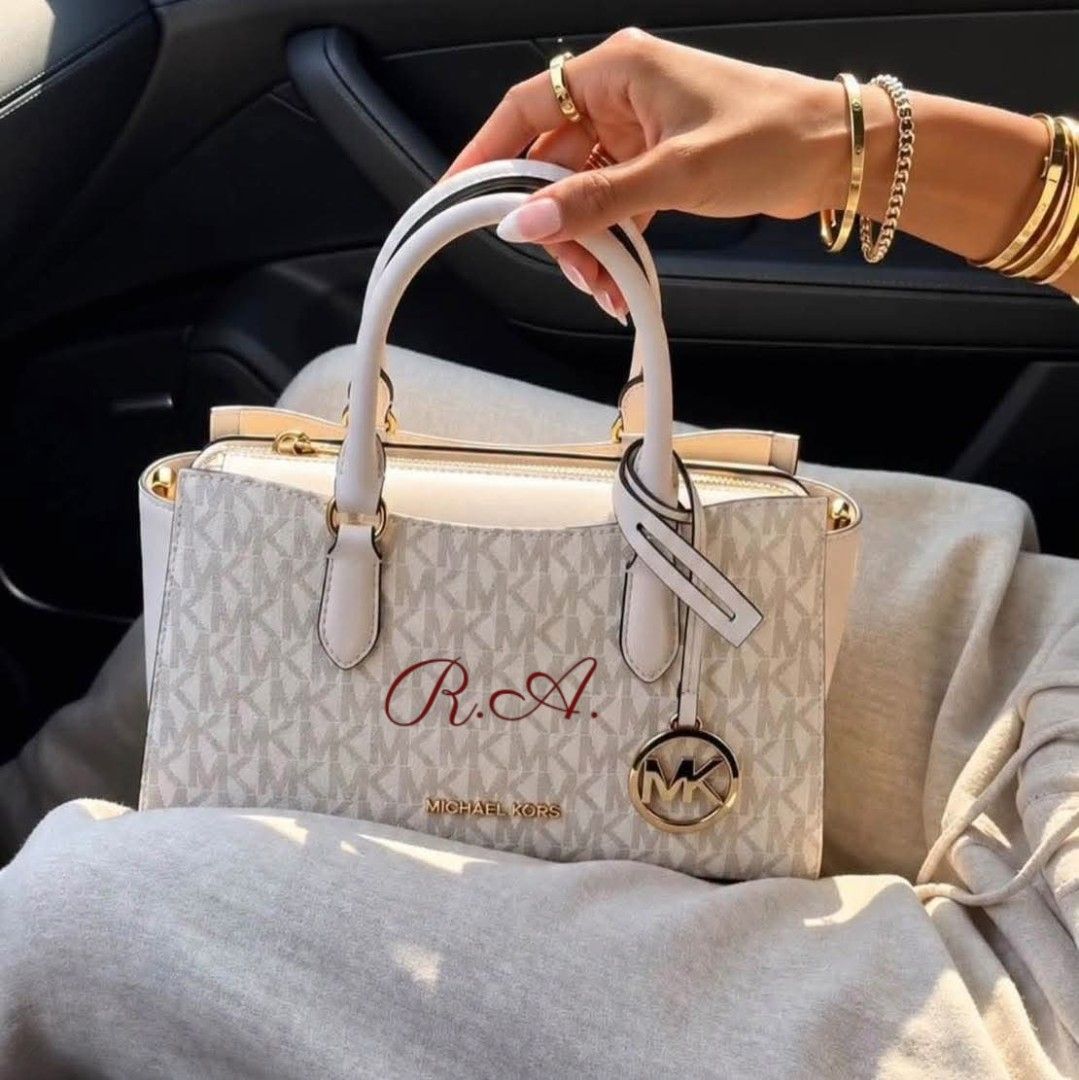 Michael Kors White Monogram Satchel Handbag (Category: Luxury Bags & Wallets) located in Manila. Submitted by rhona30antiquera (Listing ID 1470559891, Image 2). Description: 🚨PRE-ORDER ALERT🚨 ₱4,600 ONLY! • 10”W X 5.5”H X 2”D • Adjustable strap: 20.5"-24" • Exterior details: back and front slip pockets • Interior details: back slip pocket • Zip fastening • Inclusion: Tag, card, poly DP: ₱2,000 ETA: 2-3 weeks✈️✈️✈️.