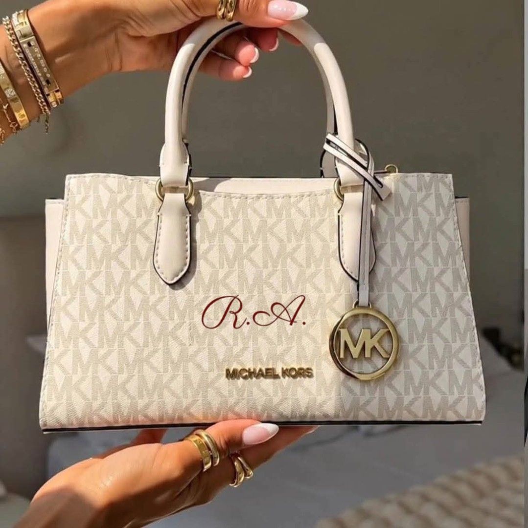 Michael Kors White Monogram Satchel Handbag (Category: Luxury Bags & Wallets) located in Manila. Submitted by rhona30antiquera (Listing ID 1470559891, Image 1). Description: 🚨PRE-ORDER ALERT🚨 ₱4,600 ONLY! • 10”W X 5.5”H X 2”D • Adjustable strap: 20.5"-24" • Exterior details: back and front slip pockets • Interior details: back slip pocket • Zip fastening • Inclusion: Tag, card, poly DP: ₱2,000 ETA: 2-3 weeks✈️✈️✈️.
