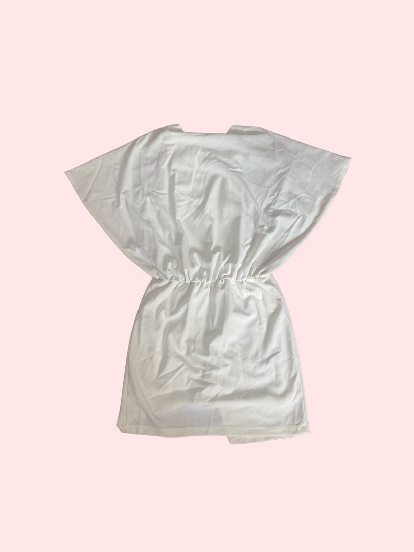 Minimalist Elastic Waist Mini Dress White (Category: Dresses) located in Pasig City. Submitted by kia.sell (Listing ID 1470652949, Image 2). Description: • Brand: harlan + holden • Style: Minimalist fluid dolman-sleeve mini dress • Color: Clean White / Off-White • Design Details: Relaxed drop-shoulder dolman sleeves, flattering gathered elastic waist, very smart casual • Condition: Excellent pre-loved condition, white is with no yellowing or stai