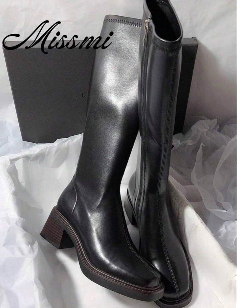 Black Knee-High Boots Block Heel (Category: Boots) located in Makati City. Submitted by closetcleanuph (Listing ID 1470662702, Image 2). Description: - Brand: Missmi - Color: Black - Style: Knee-high boots with a trendy square toe and chunky block heel - Material: Soft synthetic leather with a durable ribbed rubber sole - Convenience: Side zipper for easy wearing - Versatility: Perfect for streetwear, oversized jackets, and skirts.