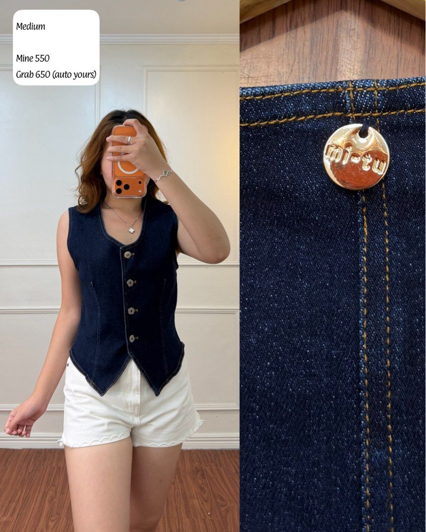 mi-tu Dark Denim Vest Medium (Category: Sleeveless) located in Manila. Submitted by angelll0123 (Listing ID 1470699510, Image 1). Description: - Brand: mi-tu - Size: Medium - Color: Clean dark blue wash with contrast stitching - Style: Fitted cut, V-neckline, and unique pointed hemline - Details: Gold-tone hardware with metallic logo stamp - Versatility: Easy to layer over tees or wear on its own with shorts.