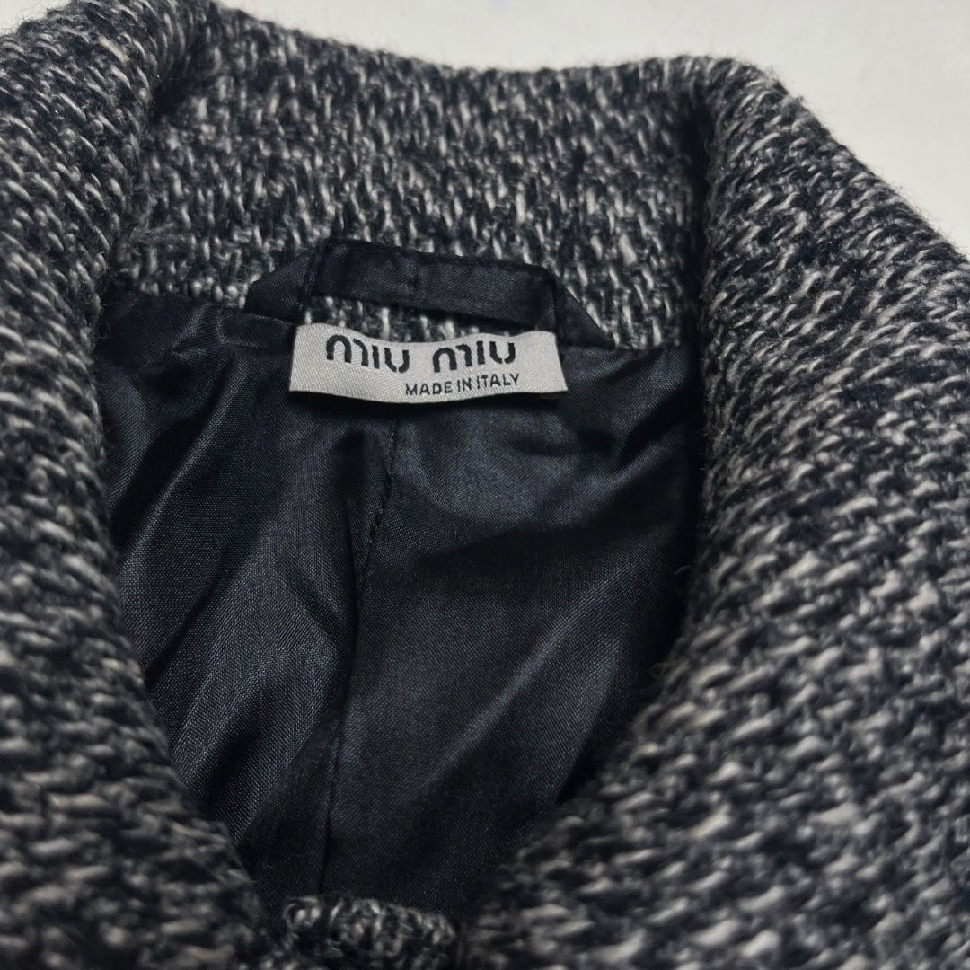 Miu Miu Black and White Wool Jacket (Category: Coats, Jackets and Outerwear) located in Caloocan City. Submitted by achilles_grails (Listing ID 1470603315, Image 2). Description: - Brand: Miu Miu - Origin: Made in Italy - Size: 36 - Material: 75% virgin wool, 20% nylon, 5% cashmere blend - Color: Black and white tweed - Lining: Fully lined in black - Details: Collar neckline, front pockets, button closure - Condition: Excellent luxury find.