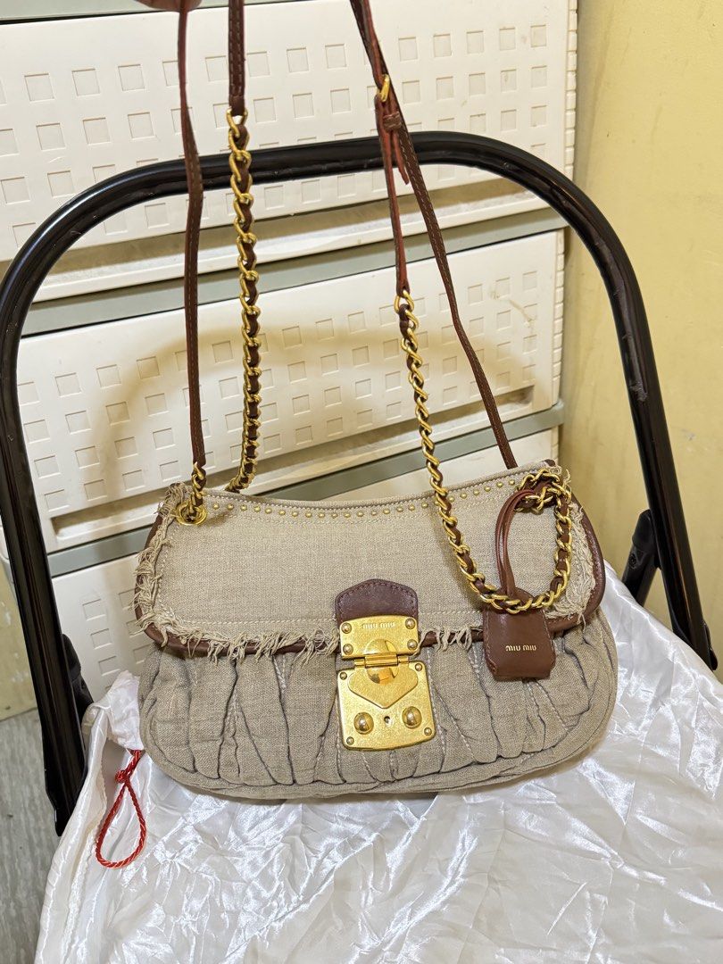 Miu Miu Matelasse Linen Shoulder Bag (Category: Luxury Bags & Wallets) located in Mandaluyong City. Submitted by yumbougieee (Listing ID 1470558648, Image 2). Description: Excellent condition. No damages No cracks, no tear. Gently used Authentic. miu miu. Chanel vibes Can used as shoulder or crossbody bag.