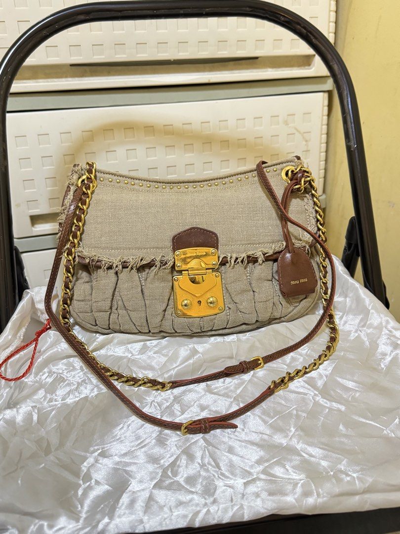 Miu Miu Matelasse Linen Shoulder Bag (Category: Luxury Bags & Wallets) located in Mandaluyong City. Submitted by yumbougieee (Listing ID 1470558648, Image 1). Description: Excellent condition. No damages No cracks, no tear. Gently used Authentic. miu miu. Chanel vibes Can used as shoulder or crossbody bag.