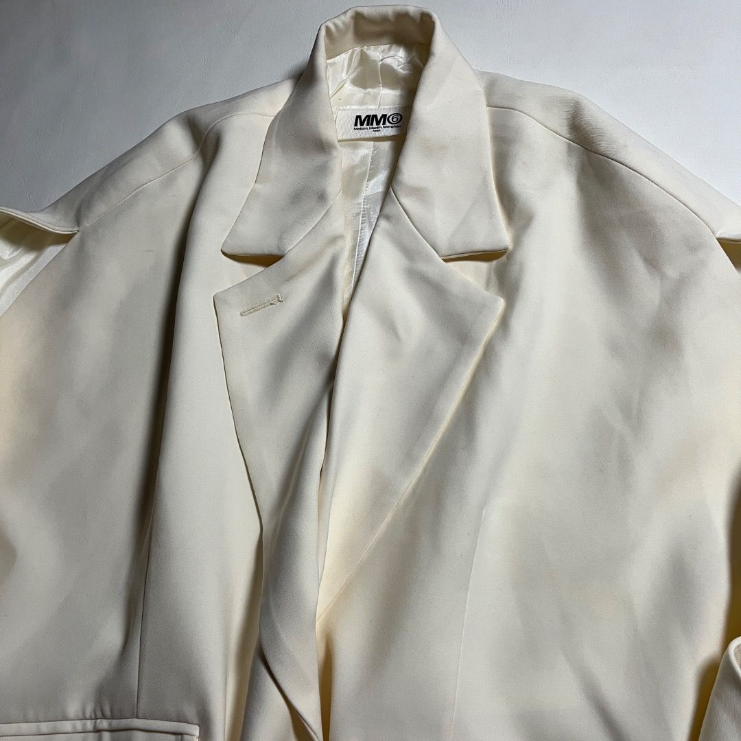 MM6 Maison Martin Margiela Circular Blazer Jacket (Category: Sleeveless) located in Caloocan City. Submitted by achilles_grails (Listing ID 1470728292, Image 2). Description: - Brand: MM6 Maison Martin Margiela - Style: Sleeveless blazer / vest in cream white - Design: Tailored lapels, front button closure, and waist flap pockets - Signature Detail: Iconic horizontal white stitching on the upper back - Fit: Structured silhouette with wide arm ope