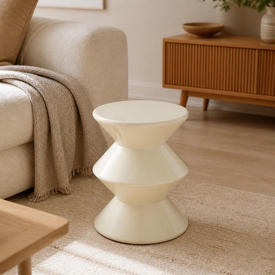 Modern geometric accent stool side table (Category: Chairs) located in Pasig City. Submitted by jk_rldn (Listing ID 1470562539, Image 2). Description: - Unique hourglass shape with three stacked geometric tiers - Glossy, light-reflecting, pristine finish - Heavy-duty plastic build suitable as a side table or extra seat - Smooth flat top safely holds drinks and small decor - Clean minimalist design ideal for contemporary spaces.
