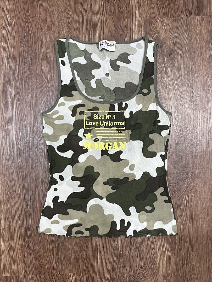 Morgan de Toi Camo Mesh Tank Top (Category: Sleeveless) located in Paranaque City. Submitted by piajajaja (Listing ID 1470698807, Image 1). Description: - Brand: Morgan de Toi - Print: Green camouflage with chest graphic & star detail - Neckline: Scoop neck - Hem: Lettuce hem - Thrifted but only used once - RFS: Not my style anymore.