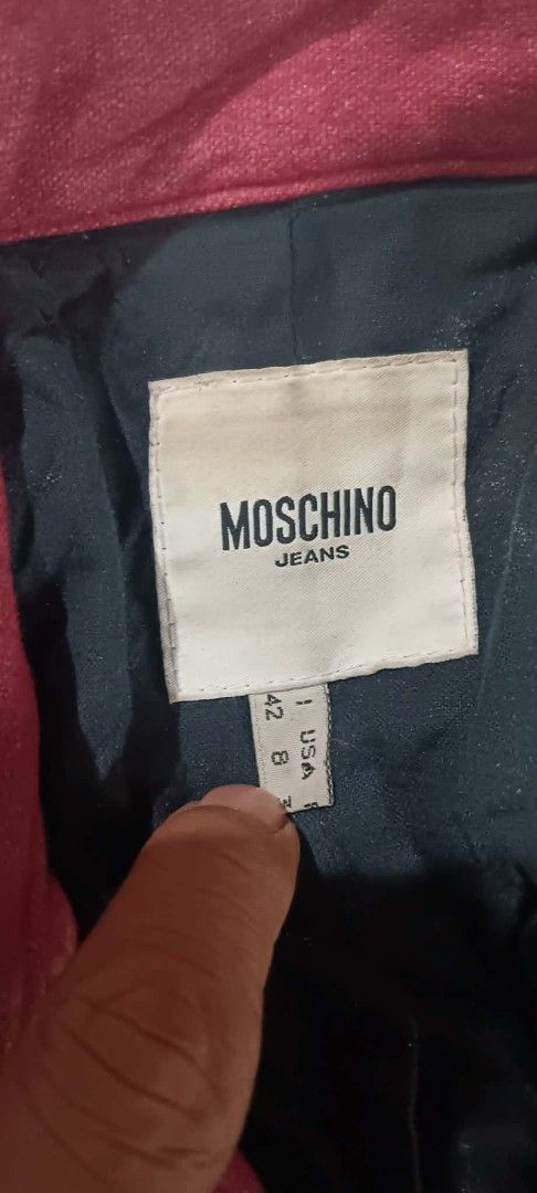 Moschino Jeans Red Long Coat Trench Jacket Size 42 (Category: Coats, Jackets and Outerwear) located in Manila. Submitted by borbone13335092 (Listing ID 1470560521, Image 3). Description: - Brand: Moschino Jeans - Style: Long coat with button front closure and matching fabric belt with buckle - Color: Dark red / pink with dark inner lining - Size: 42 IT / 8 USA - Material: Premium wool blend (58% virgin wool, 30% viscose, 6% nylon, 4% mohair, 2% e