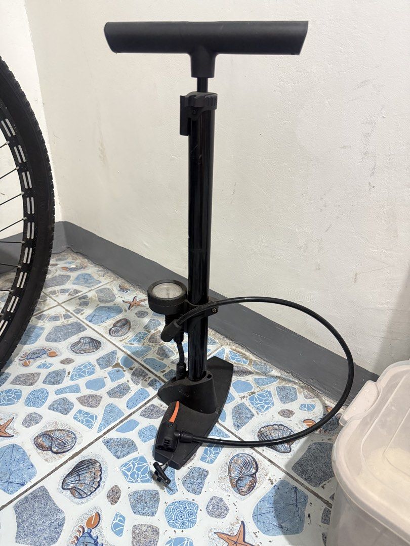 Mountain Bike and Floor Pump Set (Category: Bicycles) located in Manila. Submitted by hazeleran030614 (Listing ID 1470639578, Image 1). Description: - Bundle includes: 2 mountain bikes and 1 black floor pump - Bike 1: Black and red with suspension forks and disc brakes - Bike 2: Black and orange with suspension forks and disc brakes - Floor pump: Includes a convenient pressure gauge at the base - Ideal for: Weekend trail rides and daily commuting