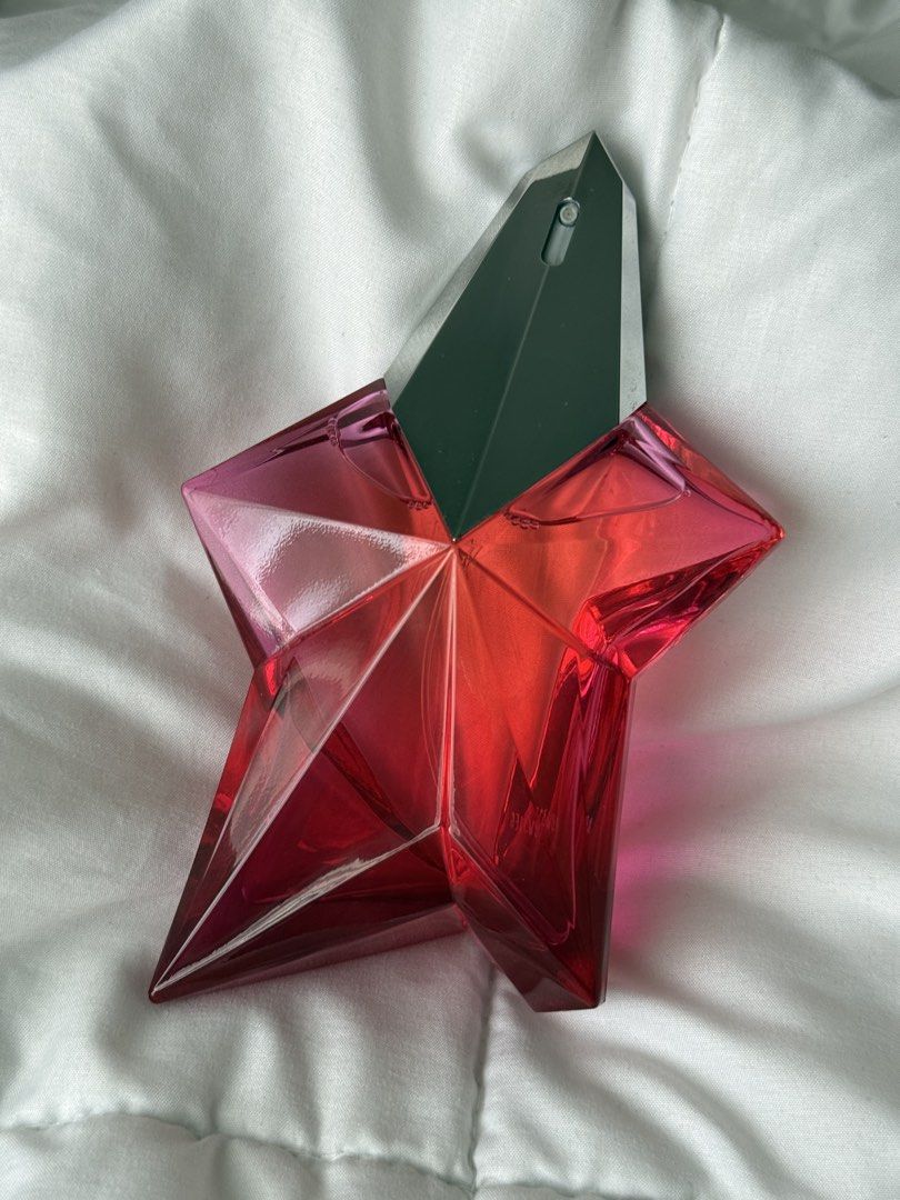 Mugler Angel Nova Eau de Parfum 100ml (Category: Fragrance & Deodorants) located in Pasig City. Submitted by abbyrds (Listing ID 1470597173, Image 1). Description: - Authentic Mugler Angel Nova Eau de Parfum - Generous 100ml size, barely used (almost full) - Iconic rechargeable bright pink star bottle - Scent profile: Delicious fruity-floral with prominent raspberry and rose notes - Complete with original packaging/box - Perfect for daily wear or