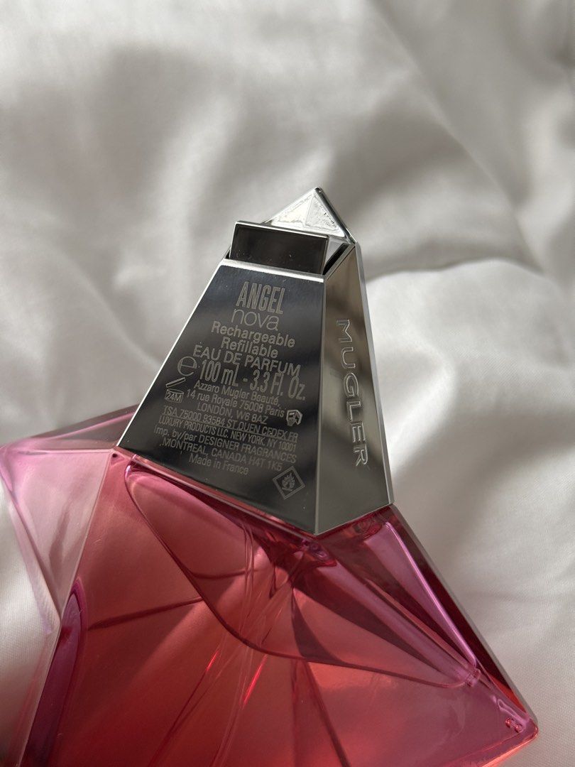 Mugler Angel Nova Eau de Parfum 100ml (Category: Fragrance & Deodorants) located in Pasig City. Submitted by abbyrds (Listing ID 1470597173, Image 3). Description: - Authentic Mugler Angel Nova Eau de Parfum - Generous 100ml size, barely used (almost full) - Iconic rechargeable bright pink star bottle - Scent profile: Delicious fruity-floral with prominent raspberry and rose notes - Complete with original packaging/box - Perfect for daily wear or