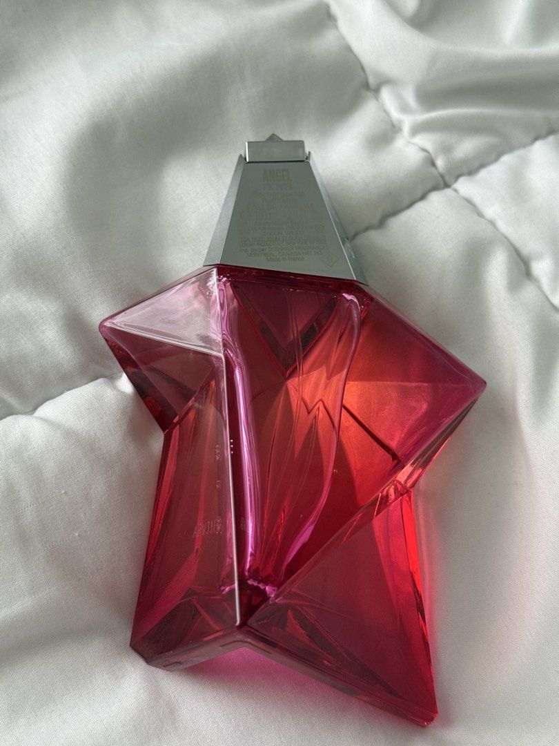 Mugler Angel Nova Eau de Parfum 100ml (Category: Fragrance & Deodorants) located in Pasig City. Submitted by abbyrds (Listing ID 1470597173, Image 2). Description: - Authentic Mugler Angel Nova Eau de Parfum - Generous 100ml size, barely used (almost full) - Iconic rechargeable bright pink star bottle - Scent profile: Delicious fruity-floral with prominent raspberry and rose notes - Complete with original packaging/box - Perfect for daily wear or