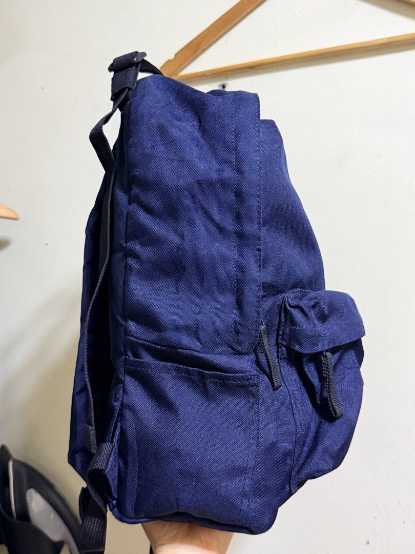 Muji Navy Blue Convertible Backpack Tote Bag (Category: Backpacks) located in Paete. Submitted by skydruemadison (Listing ID 1470691386, Image 2). Description: - Color: Deep blue canvas - Dual top tote handles and adjustable shoulder straps - Front zipper pocket for easy access - Extra side pockets and D-ring attachments on back and sides - Sturdy black webbing straps and durable zippers - Ideal for daily school use, work commutes, or weekend tra
