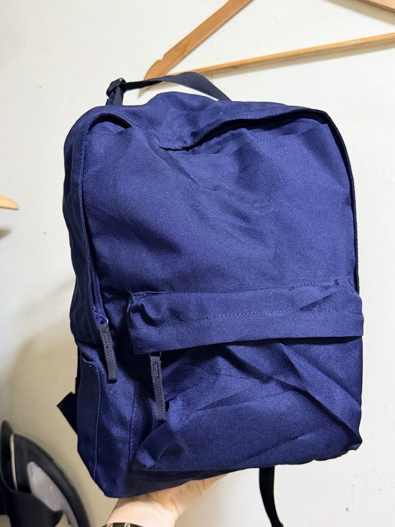Muji Navy Blue Convertible Backpack Tote Bag (Category: Backpacks) located in Paete. Submitted by skydruemadison (Listing ID 1470691386, Image 1). Description: - Color: Deep blue canvas - Dual top tote handles and adjustable shoulder straps - Front zipper pocket for easy access - Extra side pockets and D-ring attachments on back and sides - Sturdy black webbing straps and durable zippers - Ideal for daily school use, work commutes, or weekend tra
