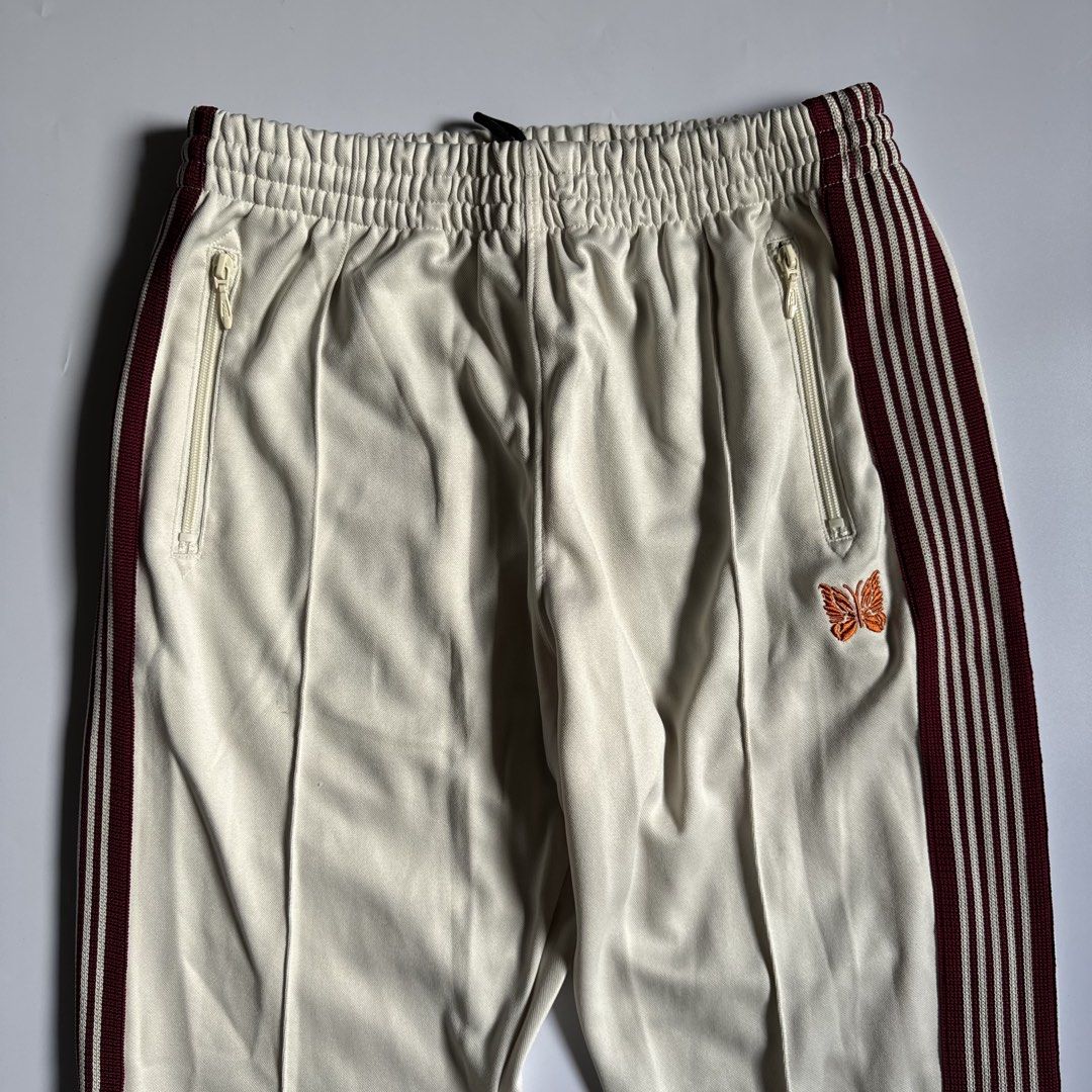 Needles Track Pants Ivory (Category: Joggers) located in Calamba. Submitted by secondsite.ph (Listing ID 1470619925, Image 2). Description: Needles Track Pants Ivory Size Large on tag (30-34) 10/10 like new No flaws ₱1580.