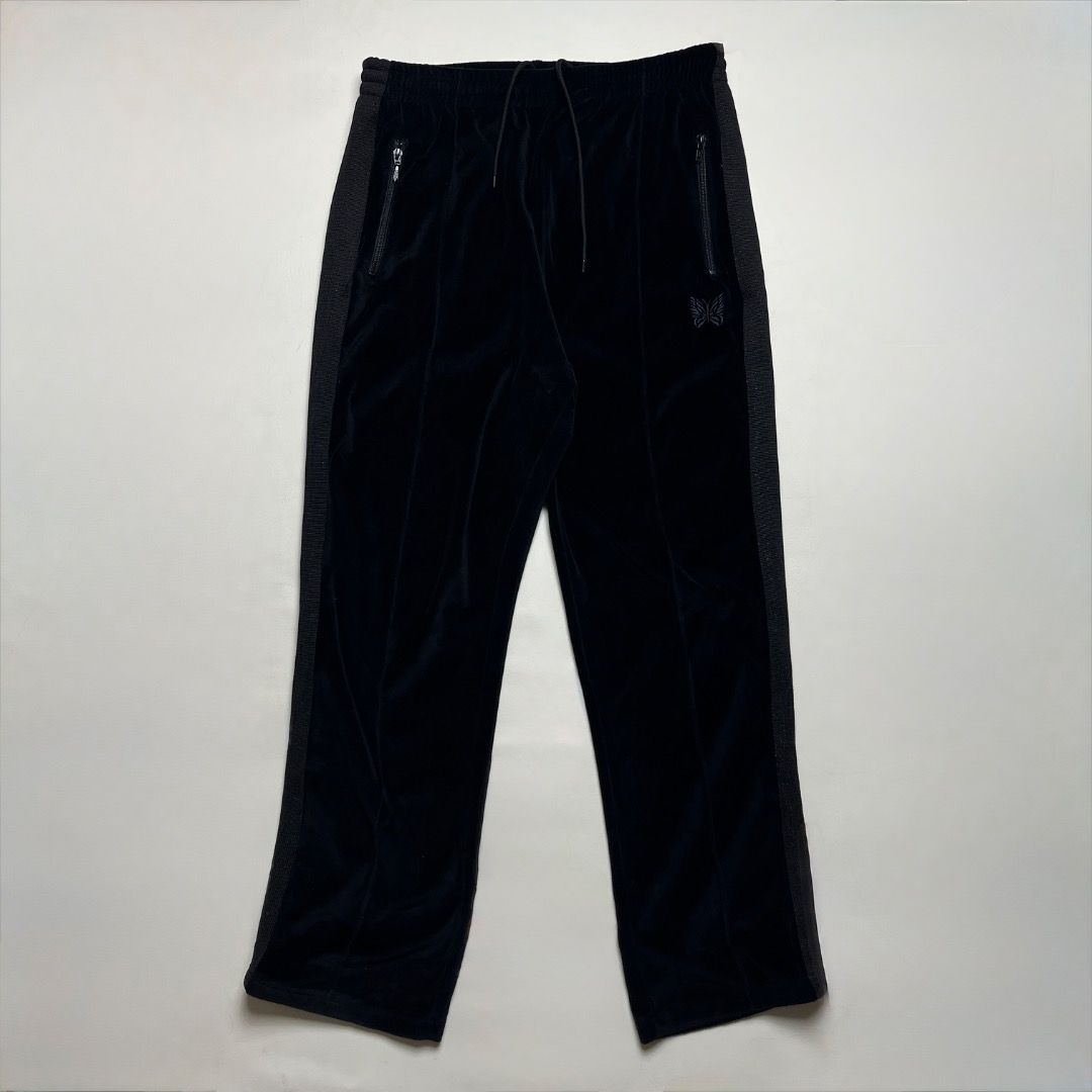 Needles Velour Track Pants Black Size M (Category: Joggers) located in Caloocan City. Submitted by achilles_grails (Listing ID 1470577740, Image 1). Description: - Brand: Needles - Item: Track Pants in Black Velour - Size: Medium (Tag attached) - Details: Embroidered butterfly logo, classic side tape striping, and side zipper pockets - Fit: Adjustable drawstring waist - Origin: Made in Japan.
