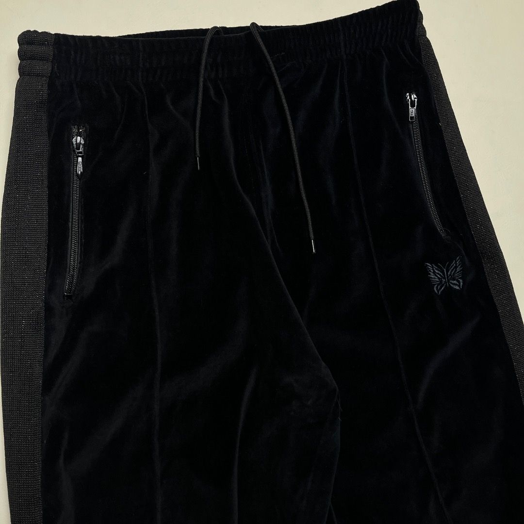 Needles Velour Track Pants Black Size M (Category: Joggers) located in Caloocan City. Submitted by achilles_grails (Listing ID 1470577740, Image 2). Description: - Brand: Needles - Item: Track Pants in Black Velour - Size: Medium (Tag attached) - Details: Embroidered butterfly logo, classic side tape striping, and side zipper pockets - Fit: Adjustable drawstring waist - Origin: Made in Japan.