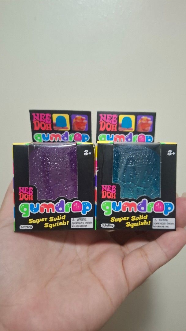 NeeDoh Gumdrop (Category: Kids Toys) located in Pasay City. Submitted by mshannahpi (Listing ID 1470666606, Image 1). Description: - Authentic Schylling NeeDoh Gumdrop squish toys (Set of 2) - Colors: Blue and Purple - Features a satisfyingly solid squeeze with fun glitter texture inside - Condition: Brand new, still in original retail packaging - Perfect for stress relief, fidgeting, or collecting - Selling as a set.