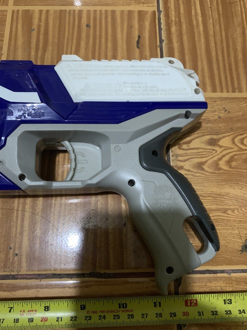 Nerf N-Strike Elite Disruptor Blaster (Category: Action & Battle Toys) located in Antipolo. Submitted by cebb888 (Listing ID 1470640017, Image 2). Description: - Model: Nerf N-Strike Elite Disruptor toy blaster - Colorway: Blue, white, and grey with an orange rotating drum - Capacity: Holds 6 darts (darts not included) - Performance: Fires up to 90 feet - Condition: Clean exterior with minor surface scuffs from previous playtime - Ideal for: Targ