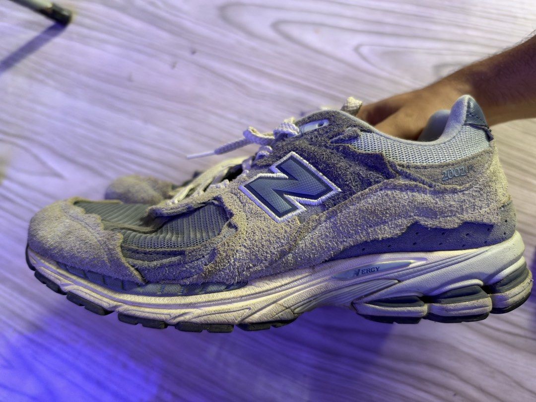 New Balance 2002R Protection Pack Rain Cloud Size 10.5M (Category: Sneakers) located in Caloocan City. Submitted by nic834427 (Listing ID 1470617078, Image 2). Description: New Balance 2002R sneakers, grey and blue colorway. Raw edges on the suede panels. Classic 2002R branding on the heel and tongue. Mesh underlays across the upper. Chunky rubber sole with ABZORB cushioning. Size US 10.5 men's. Regular signs of wear on the soles and inner lining