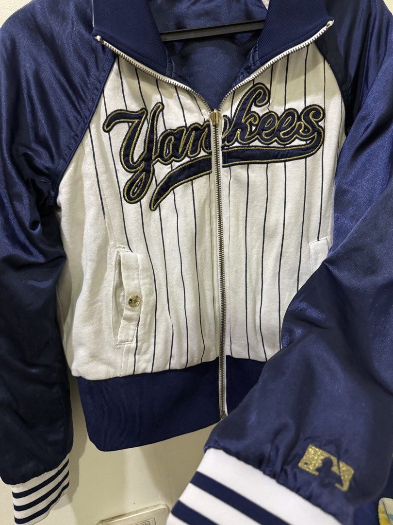 New York Yankees Reversible Bomber Jacket MLB (Category: Coats, Jackets and Outerwear) located in Cebu City. Submitted by hotchkisscebu (Listing ID 1470682501, Image 3). Description: - Official MLB New York Yankees reversible jacket - Side 1: Classic white pinstripes with large script Yankees chest lettering - Side 2: Solid navy blue with embroidered NY chest logo - Full zip front with comfortable ribbed collar and gold-accented striped cuffs - F