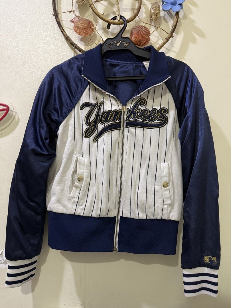 New York Yankees Reversible Bomber Jacket MLB (Category: Coats, Jackets and Outerwear) located in Cebu City. Submitted by hotchkisscebu (Listing ID 1470682501, Image 1). Description: - Official MLB New York Yankees reversible jacket - Side 1: Classic white pinstripes with large script Yankees chest lettering - Side 2: Solid navy blue with embroidered NY chest logo - Full zip front with comfortable ribbed collar and gold-accented striped cuffs - F