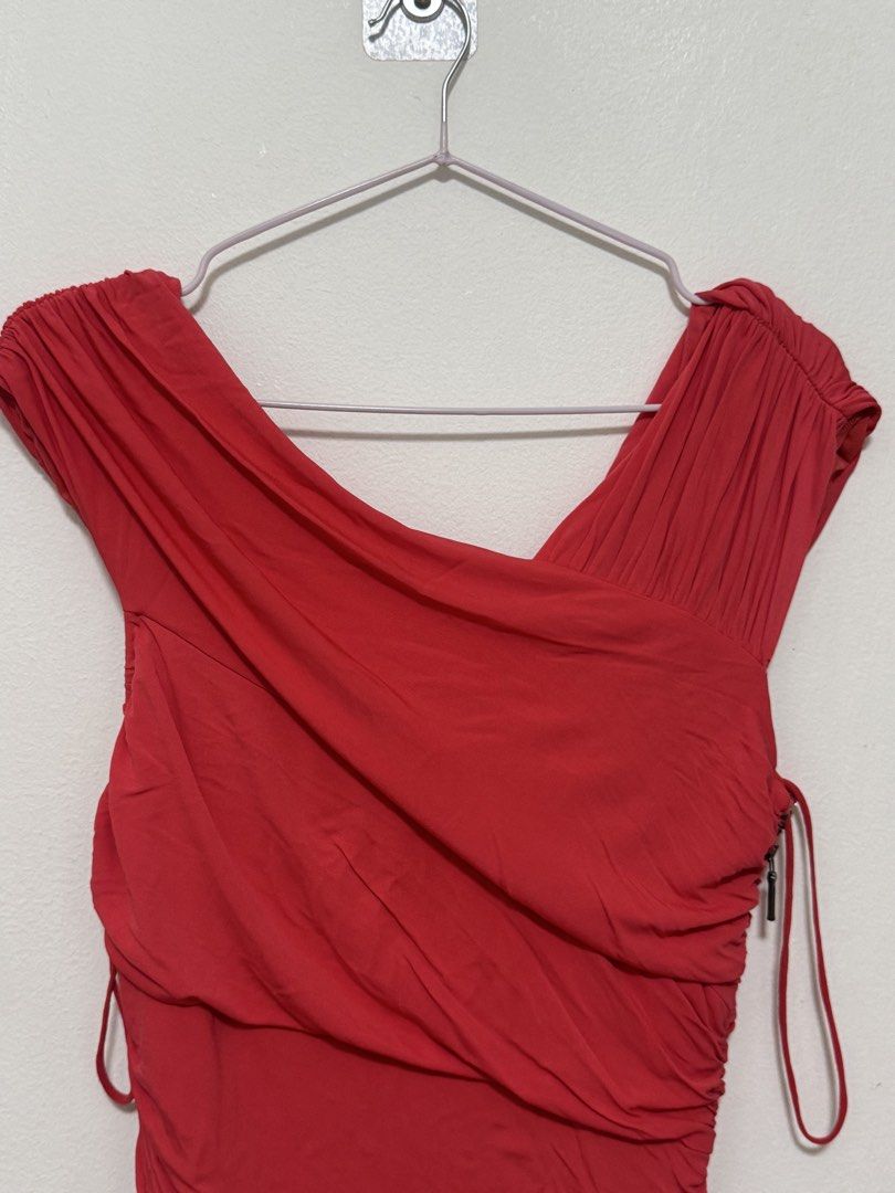 Nicole Miller Red Ruched Dress (Category: Dresses) located in Antipolo. Submitted by nathshn_ (Listing ID 1470585912, Image 2). Description: Nicole Miller red dress in size 6. Asymmetrical draped neckline with structured ruching down the body. Side zipper closure. Soft stretchy fabric with mesh lining. Good piece for parties or evening events. Can send when worn pic upon request..