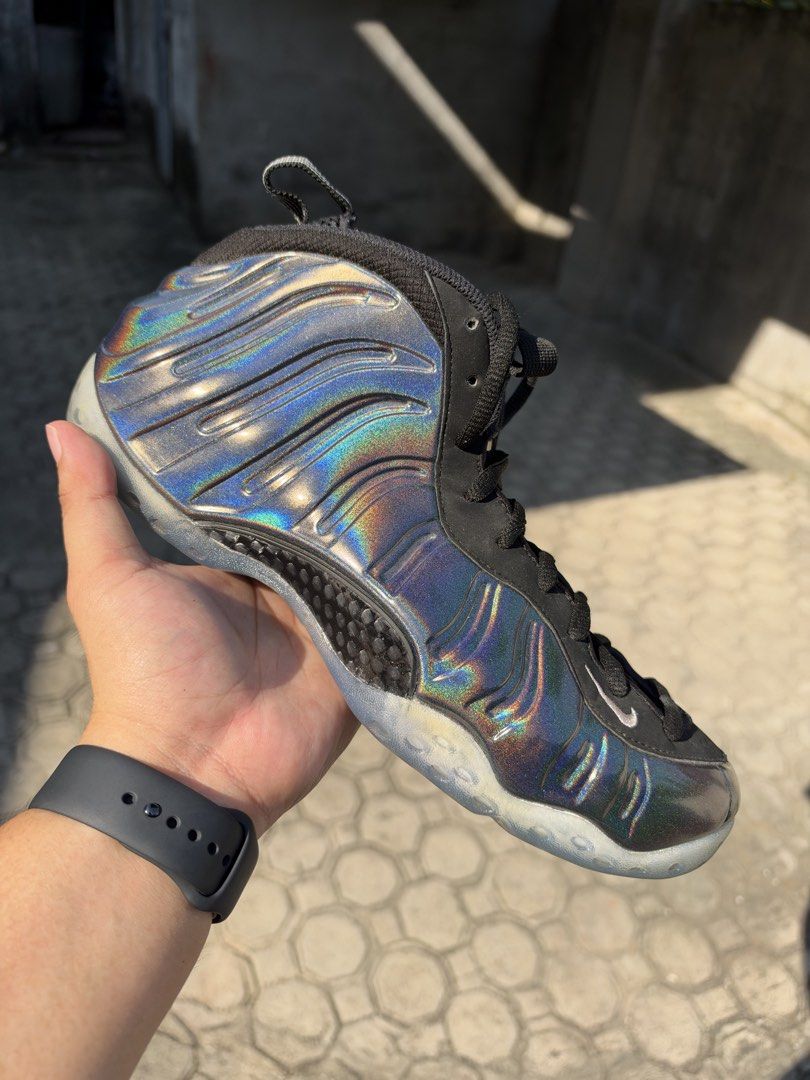 Nike Air Foamposite One Hologram (missing box) (Category: Sneakers) located in Caloocan City. Submitted by luckydeer_4f53ea (Listing ID 1470611440, Image 2). Description: - Brand: Nike Air Foamposite One - Legit App Checked - Colorway: Rare iridescent hologram (reflects multiple colors under light) - Details: Black nubuck eyestay, mesh tongue, and signature 1 Cent logo on tongue and heel - Performance/Tech: Carbon fiber shank plate for stability 