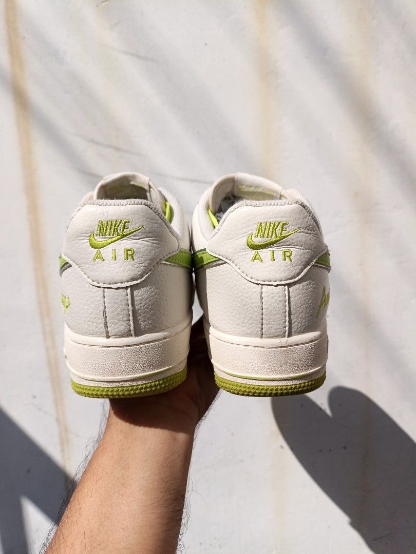 Nike Air Force 1 'Fresh' Lime Green (Category: Sneakers) located in Imus. Submitted by grindhouse.thriftshop (Listing ID 1470631704, Image 3). Description: - Brand/Model: Nike Air Force 1 Low - Colorway: White tumbled leather with neon lime green swoosh, laces, outsole, and branding - Special Detail: 'fresh' stitched cursive text near the heel - Size: US 9.5 - Condition: Clean soles with minimal wear, highly vibrant look.