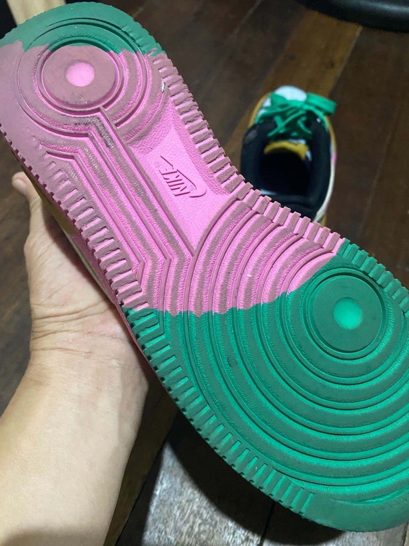 Nike Air Force 1 Low Multicolour (Category: Babies & Kids Fashion) located in Navotas City. Submitted by piozonvhon (Listing ID 1470567246, Image 3). Description: Multicolour Nike Air Force 1 Low sneakers. Bold mix of black, yellow, pink, light blue, and green panels. Bright green laces. Yellow tongue tag with Nike branding. Upside down Nike Air logo embroidered on the heel tabs. Visible wear on the collar lining with a small rip. Pink and green 