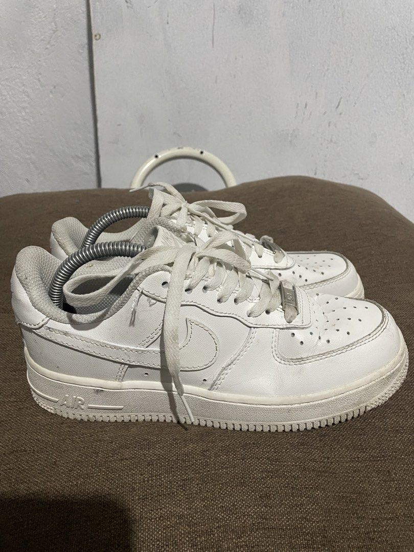 Nike Air Force 1 Low White GS Size US 5 (Category: Sneakers) located in Calabanga. Submitted by balobalocr30793 (Listing ID 1470681879, Image 3). Description: - Brand/Model: Nike Air Force 1 Low (Triple White) - Size: US 5 / UK 4 / EUR 37 - Material: Leather upper with perforated toe box and metal AF1 dubraes - Sole: Rubber cupsole with Air cushioning unit - Condition: Minor creasing on toe box, light dirt marks on midsole, and standard tread wea