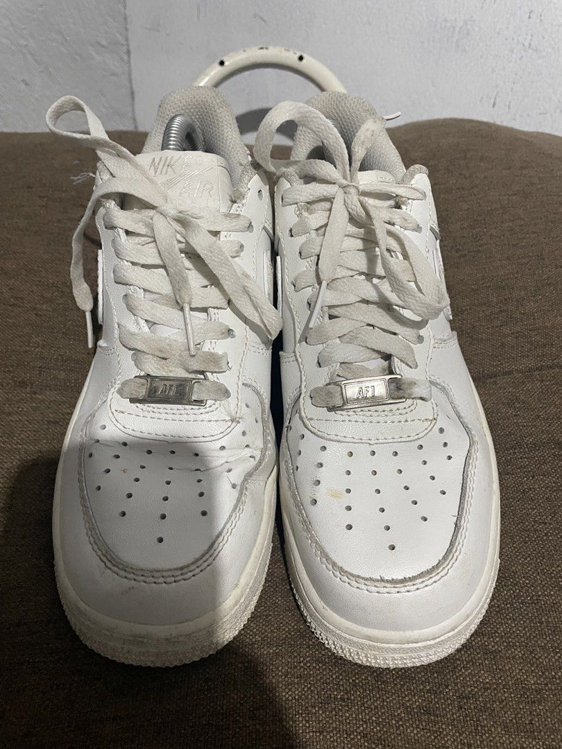Nike Air Force 1 Low White GS Size US 5 (Category: Sneakers) located in Calabanga. Submitted by balobalocr30793 (Listing ID 1470681879, Image 2). Description: - Brand/Model: Nike Air Force 1 Low (Triple White) - Size: US 5 / UK 4 / EUR 37 - Material: Leather upper with perforated toe box and metal AF1 dubraes - Sole: Rubber cupsole with Air cushioning unit - Condition: Minor creasing on toe box, light dirt marks on midsole, and standard tread wea