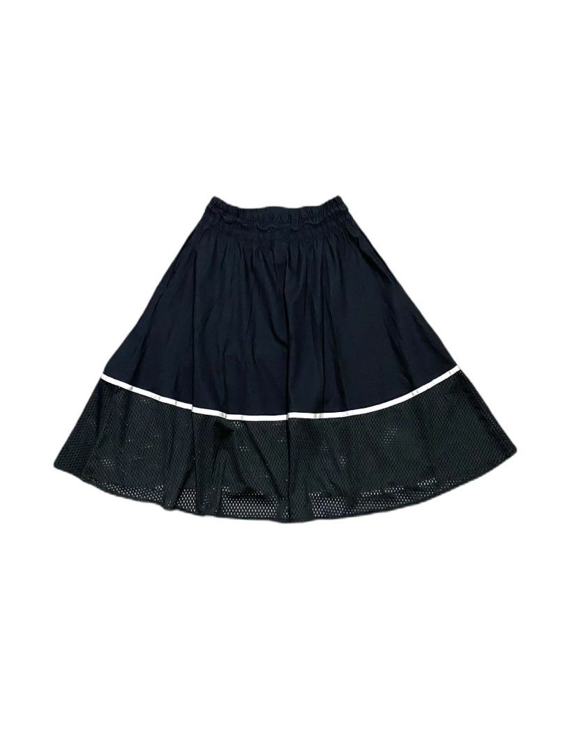 Nike Black Mesh Hem Skirt (Category: Skirts) located in Manila. Submitted by jc.dingz1024 (Listing ID 1470720457, Image 2). Description: - Brand: Nike - Style: Sporty midi skirt with drawstring waist and side pockets - Design: Solid fabric on top, mesh hem at the bottom - Details: Reflective stripe divider and bold white Nike lettering on front and back - Versatility: Great for gym workouts or casual everyday styling - Condition: Excellent (ready
