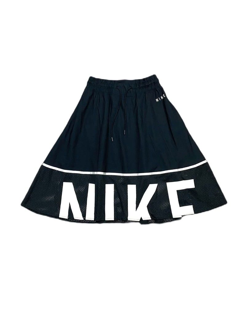 Nike Black Mesh Hem Skirt (Category: Skirts) located in Manila. Submitted by jc.dingz1024 (Listing ID 1470720457, Image 1). Description: - Brand: Nike - Style: Sporty midi skirt with drawstring waist and side pockets - Design: Solid fabric on top, mesh hem at the bottom - Details: Reflective stripe divider and bold white Nike lettering on front and back - Versatility: Great for gym workouts or casual everyday styling - Condition: Excellent (ready