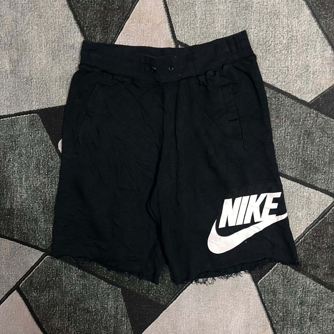 Nike Black Shorts with Big Logo Print (Category: Shorts) located in Cebu City. Submitted by royalwolf-2a85 (Listing ID 1470694277, Image 2). Description: - Color: Classic black with large white Nike logo on the leg - Design: Stylish raw hem finish for a streetwear look - Waistband: Comfortable elastic waistband with drawstring eyelets - Pockets: Two front pockets and one back pocket featuring an iconic orange Nike tag - Versatility: Great for dai