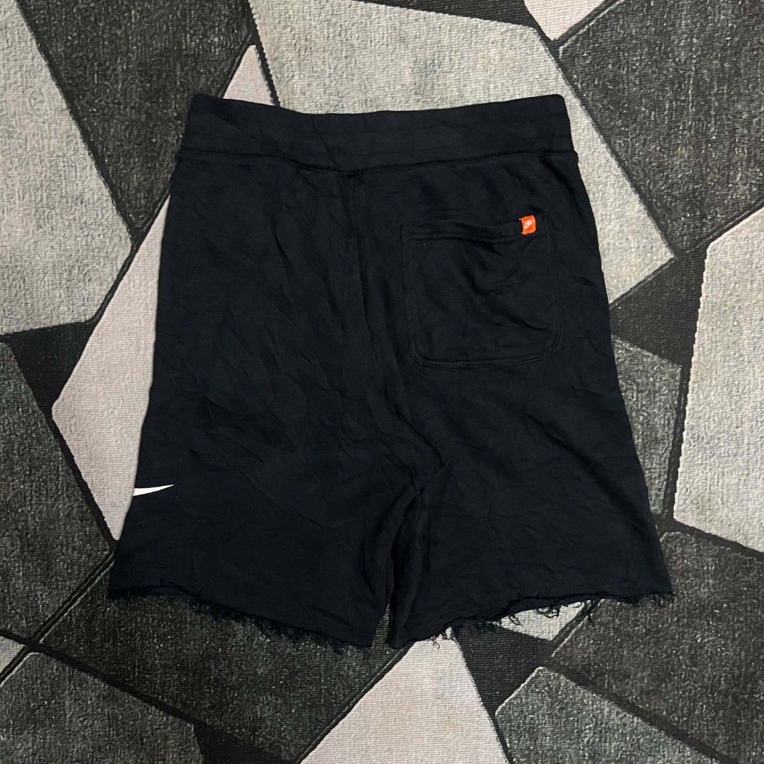 Nike Black Shorts with Big Logo Print (Category: Shorts) located in Cebu City. Submitted by royalwolf-2a85 (Listing ID 1470694277, Image 3). Description: - Color: Classic black with large white Nike logo on the leg - Design: Stylish raw hem finish for a streetwear look - Waistband: Comfortable elastic waistband with drawstring eyelets - Pockets: Two front pockets and one back pocket featuring an iconic orange Nike tag - Versatility: Great for dai