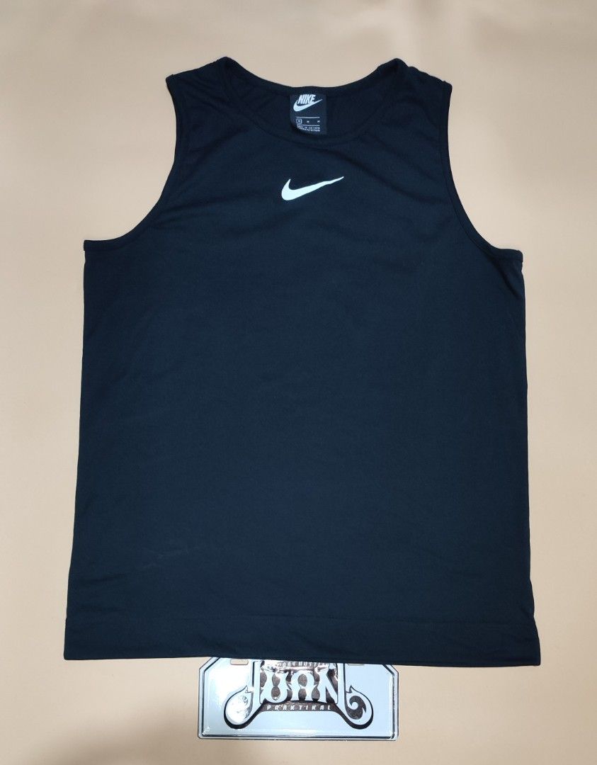 Nike Black Tank Top With Large Swoosh Size M (Category: Sleeveless) located in Cavite. Submitted by juanpraktikal (Listing ID 1470738921, Image 1). Description: -Maganda din fit sa mens 😊 - Brand: Nike - Style: Tank top with giant back swoosh and small chest swoosh - Color: Black - Size: Medium (20.5" width x 27" length) - Material: 76% polyester, 24% cotton - Origin: Made in Vietnam - Style Code: CW3217-010 - Condition: Clean, excellent, and re