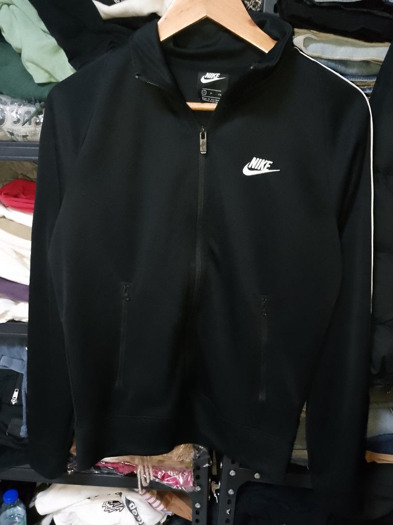 Nike Black Track Jacket Size S (Category: Coats, Jackets and Outerwear) located in Manila. Submitted by mjthrifted_second (Listing ID 1470608102, Image 1). Description: - Brand: Nike - Item: Black track jacket with white side stripes - Size: S (Made in Vietnam) -Dimes: 21/26 - Material: 100% polyester body, cotton pocket bags - Features: Full zip closure, embroidered chest logo, zippered side pockets - Condition: Clean inside and out, excellent p