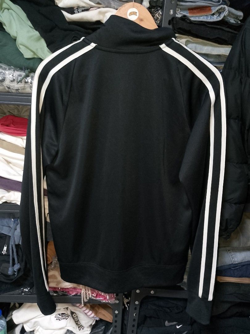 Nike Black Track Jacket Size S (Category: Coats, Jackets and Outerwear) located in Manila. Submitted by mjthrifted_second (Listing ID 1470608102, Image 2). Description: - Brand: Nike - Item: Black track jacket with white side stripes - Size: S (Made in Vietnam) -Dimes: 21/26 - Material: 100% polyester body, cotton pocket bags - Features: Full zip closure, embroidered chest logo, zippered side pockets - Condition: Clean inside and out, excellent p