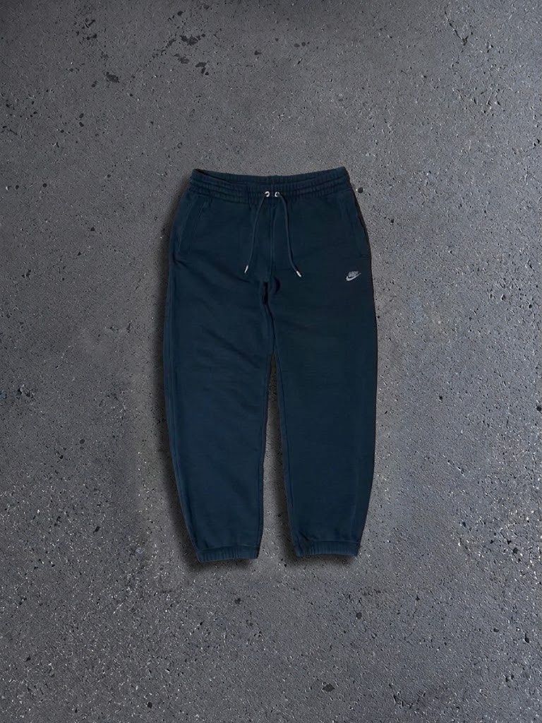 Nike Dark Grey Joggers Sweatpants (Category: Joggers) located in Polangui. Submitted by thrift2house (Listing ID 1470579597, Image 1). Description: - Color: Dark grey - Brand: Nike with embroidered small white swoosh logo near left pocket - Waistband: Elastic with adjustable drawstrings - Fit: Relaxed fit through the legs with cuffed ankles - Ideal for: Lounging, running errands, or working out - Condition: Brand new / Excellent quality.