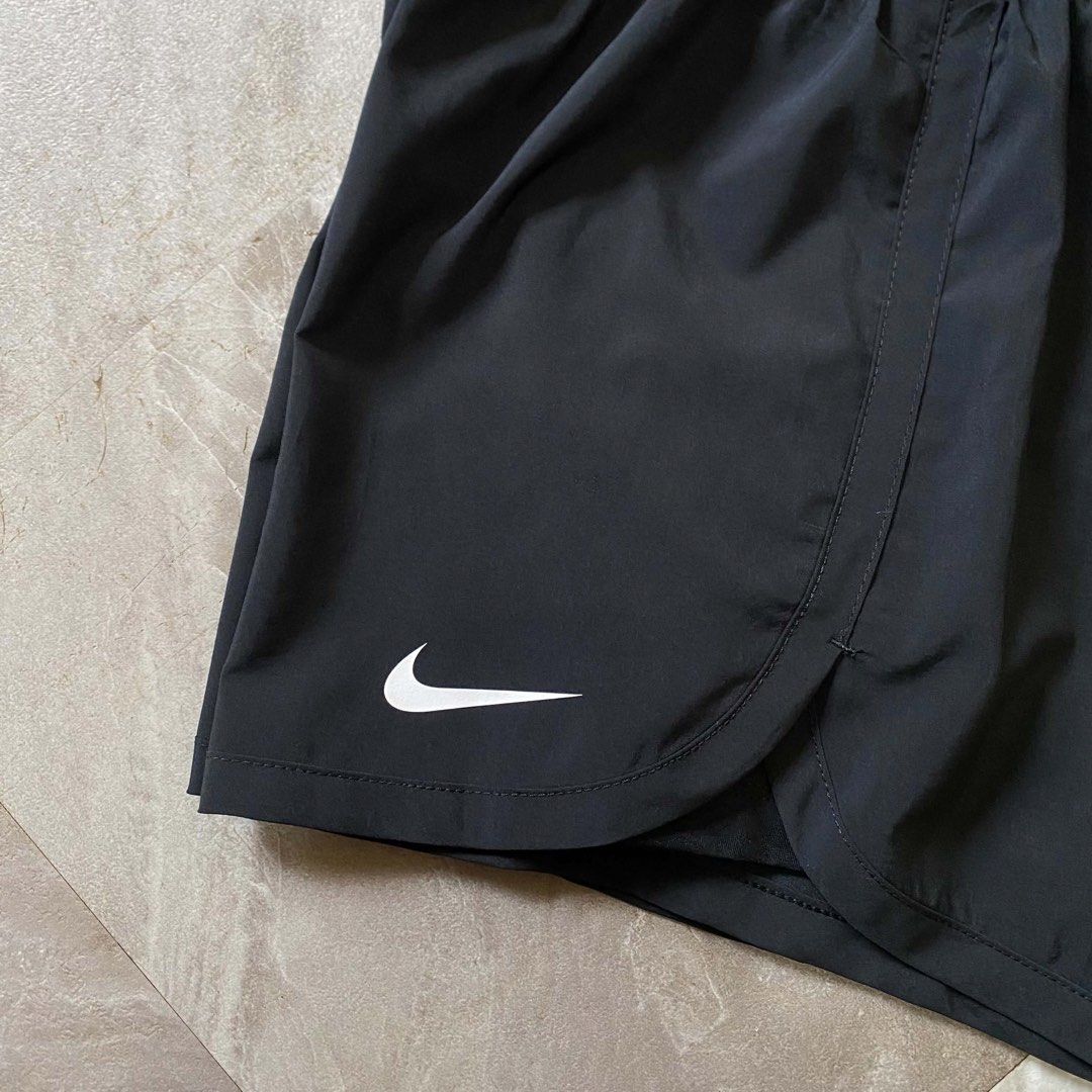 Nike Dri-FIT Just Do It Running Shorts (Category: Shorts) located in Butuan. Submitted by jc13thrifts (Listing ID 1470617155, Image 3). Description: - Brand: Nike - Style: Dri-FIT Running Shorts - Color: Black - Size: Small (tag attached) - Features: Elastic waistband with white 'Just Do It' branding - Extra: Built-in liner shorts with a small zippered back pocket - Logo: Swoosh printed on the right hem - Condition: Excellent.