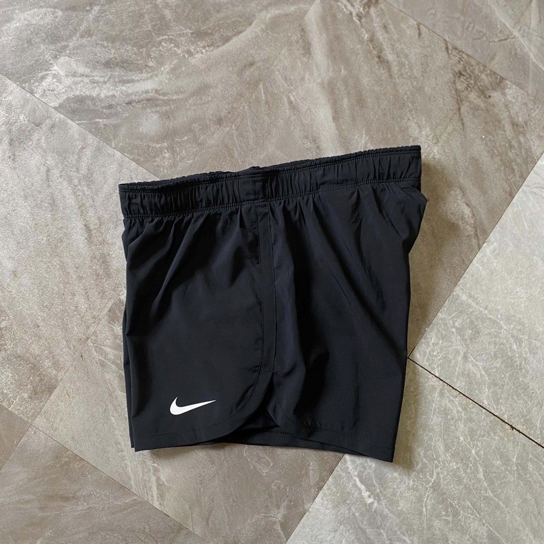 Nike Dri-FIT Just Do It Running Shorts (Category: Shorts) located in Butuan. Submitted by jc13thrifts (Listing ID 1470617155, Image 2). Description: - Brand: Nike - Style: Dri-FIT Running Shorts - Color: Black - Size: Small (tag attached) - Features: Elastic waistband with white 'Just Do It' branding - Extra: Built-in liner shorts with a small zippered back pocket - Logo: Swoosh printed on the right hem - Condition: Excellent.