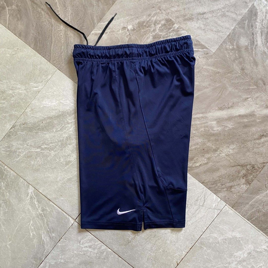 Nike Dri-FIT Navy Blue Athletic Shorts (Category: Shorts) located in Butuan. Submitted by jc13thrifts (Listing ID 1470617601, Image 2). Description: - Brand: Nike - Style: Dri-FIT Training Shorts - Color: Dark Navy Blue - Size/Fit: Regular with elastic waistband & adjustable black drawstring - Features: Moisture-wicking lightweight fabric, functional side pockets, embroidered white Swoosh logo - Condition: Clean, minimal signs of wear.